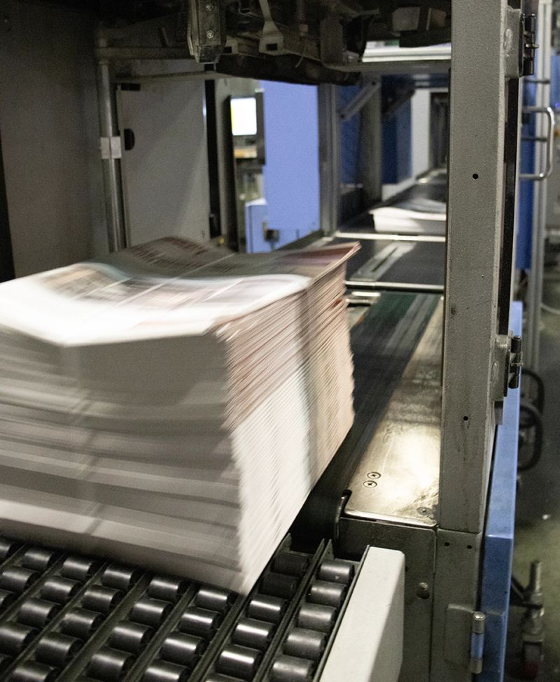 Commercial printing press producing high-quality marketing materials